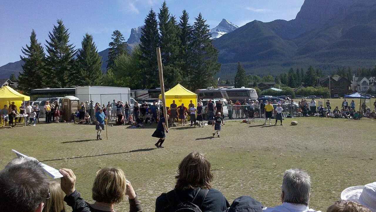Athlete tossing the caber at a Scottish Highland games